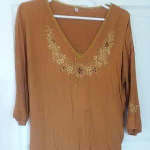 RUSTY LONG SLEEVE BLOUSE WITH EMBROIDERY ON FRONT.